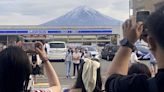 Japanese town builds giant screen to block views of Mount Fuji and deter tourist crowds