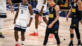 ...Porter Jr. and Aaron Gordon of the Denver Nuggets walk to the bench for a timeout during the fourth quarter of the Timberwolves’ 106-80 win at Ball Arena in Denver on Monday...
