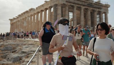 Greece closes more ancient tourist sites as heatwave persists