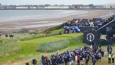 Justin Leonard hits the first shot of the 152nd Open at a cloudy Troon