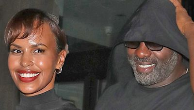 Idris Elba and Sabrina lock hands as they leave birthday bash