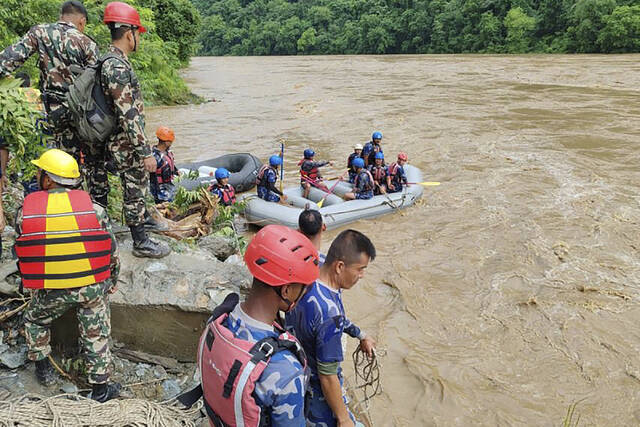 2 buses carrying more than 50 people were swept into a river by a landslide in Nepal