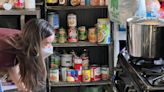 Stanford PhD student Metta Nicholson observes a gas burner in a home where scientists measured air pollution