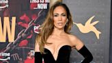 JLo's floral-encrusted gold bra flashes major side and underboob