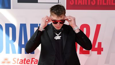 Dalton Knecht flashed all-black suit with orange Tennessee highlights at NBA draft