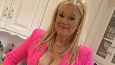 90s kids TV legend, 60, has barely aged a day as she poses in plunging outfit