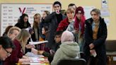 Russians cast ballots in an election preordained to extend Putin’s rule