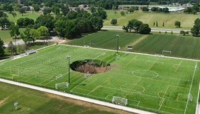 Watch: Massive sinkhole swallows soccer fields at Illinois park