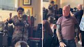 Man Dances As Woman Belts Out 80s Hit While Eating Chips
