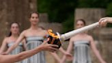 A Ukrainian gymnast carried the Paris Olympic torch with an EU team, in a sign of support