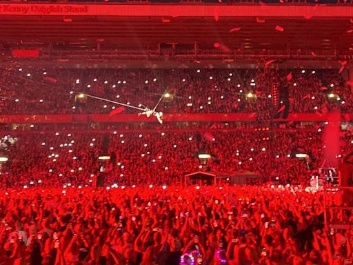 Pink takes to the sky at Anfield Stadium as she flies above the Kop