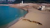 Ghost village appears out of reservoir in Spain as country hit by drought