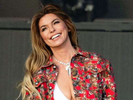 Shania Twain wows crowds in tweed mini skirt paired with sparkling white boots as she battles illness