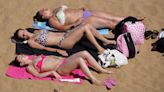 In pictures: Britain sizzles as record heatwave approaches
