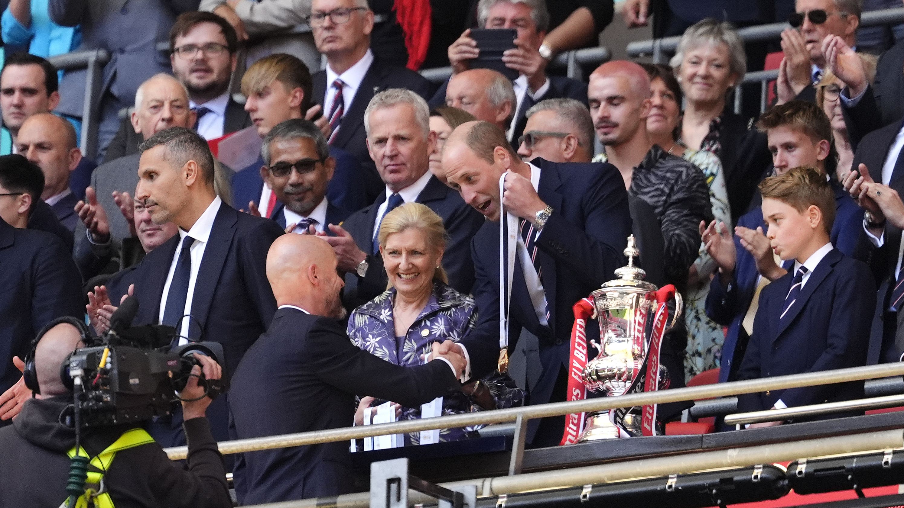 William and George present trophy to FA Cup winners Manchester United