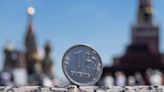 Russian rouble edges lower as month-end tax support passes