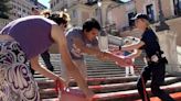 Activists pour paint down Rome’s Spanish Steps in outrage over femicide in Italy