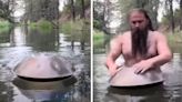 Magical: Man Rises From Water To Play Handpan In Fairy Tale Moment