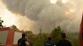 Greece sends 100 extra firefighters to a massive northeastern wildfire as it burns for a 13th day