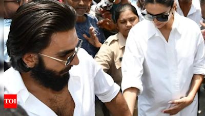 Deepika Padukone flaunts her baby bump for the first time, Ranveer Singh protects her from crowd at polling booth | Hindi Movie News - Times of India