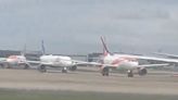 Airport chaos as planes grounded and passengers stranded on runway