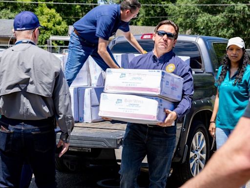 Florida Gov. DeSantis visits Tallahassee school to help distribute supplies after storm