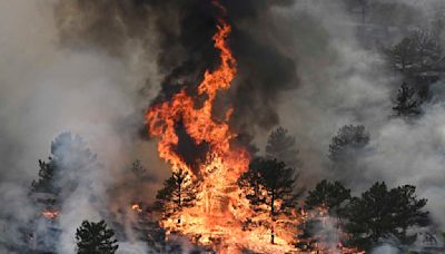 1 person killed in Colorado wildfires as blazes torch large areas of the U.S. West