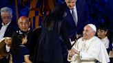 Killed Italian envoy's widow tearfully tells pope of husband's aid work