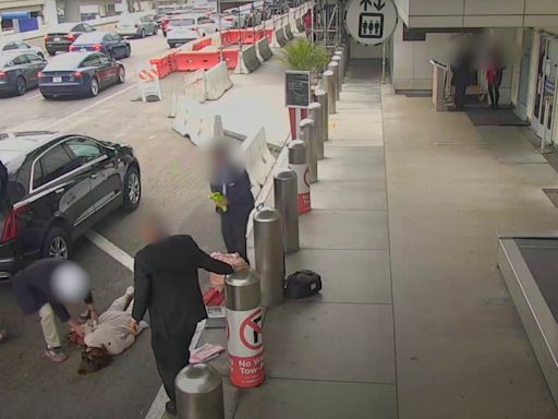 Innocent elderly woman knocked out cold at LA airport when she lands in middle of a road-rage fight