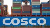 COSCO Shipping says to buy $2.7 billion port assets from parent, in $2.9 billion ship building deal