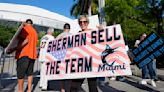A handful of disgruntled Marlins fans protest the team following the Luis Arraez trade