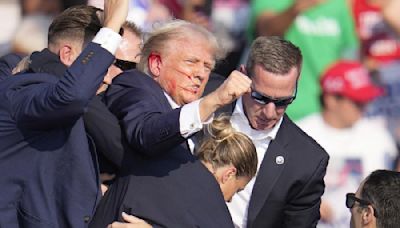 Two witnesses at Donald Trump's election rally claim to have seen shooter moving from roof to roof