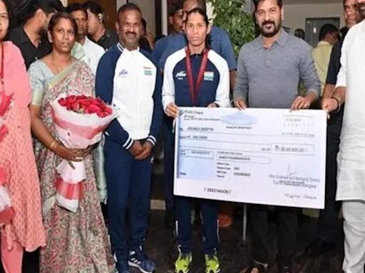 Telangana CM Revanth Reddy hands over cheque for Rs 1 crore to Paralympic bronze medallist Deepthi Jeevanji