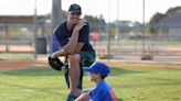Father's Day: After paralysis, MLB pitcher turned PE teacher wins on field with son, team