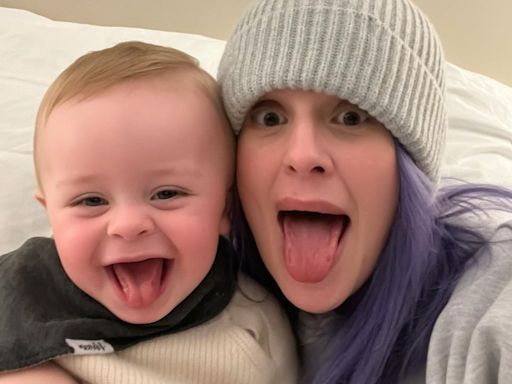 Kelly Osbourne can't keep the smile off her face as rocks bikini for pool day with son