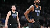 ...' Kyrie Irving and Luka Doncic pause after a Boston Celtics basket during the first half in Game 1 of the NBA Finals at TD Garden on Thursday...