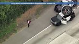 Occupants of suspected stolen car try to run across 5 Fwy after pursuit