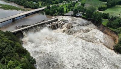 Midwestern flooding collapses a bridge, forces evacuations and kills at least 1