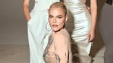 Khloe shows off thin figure in a NUDE bodysuit for Kim's SKKN party