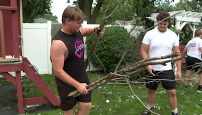 Joliet Catholic Academy football team helps coach's parents clean up after storms