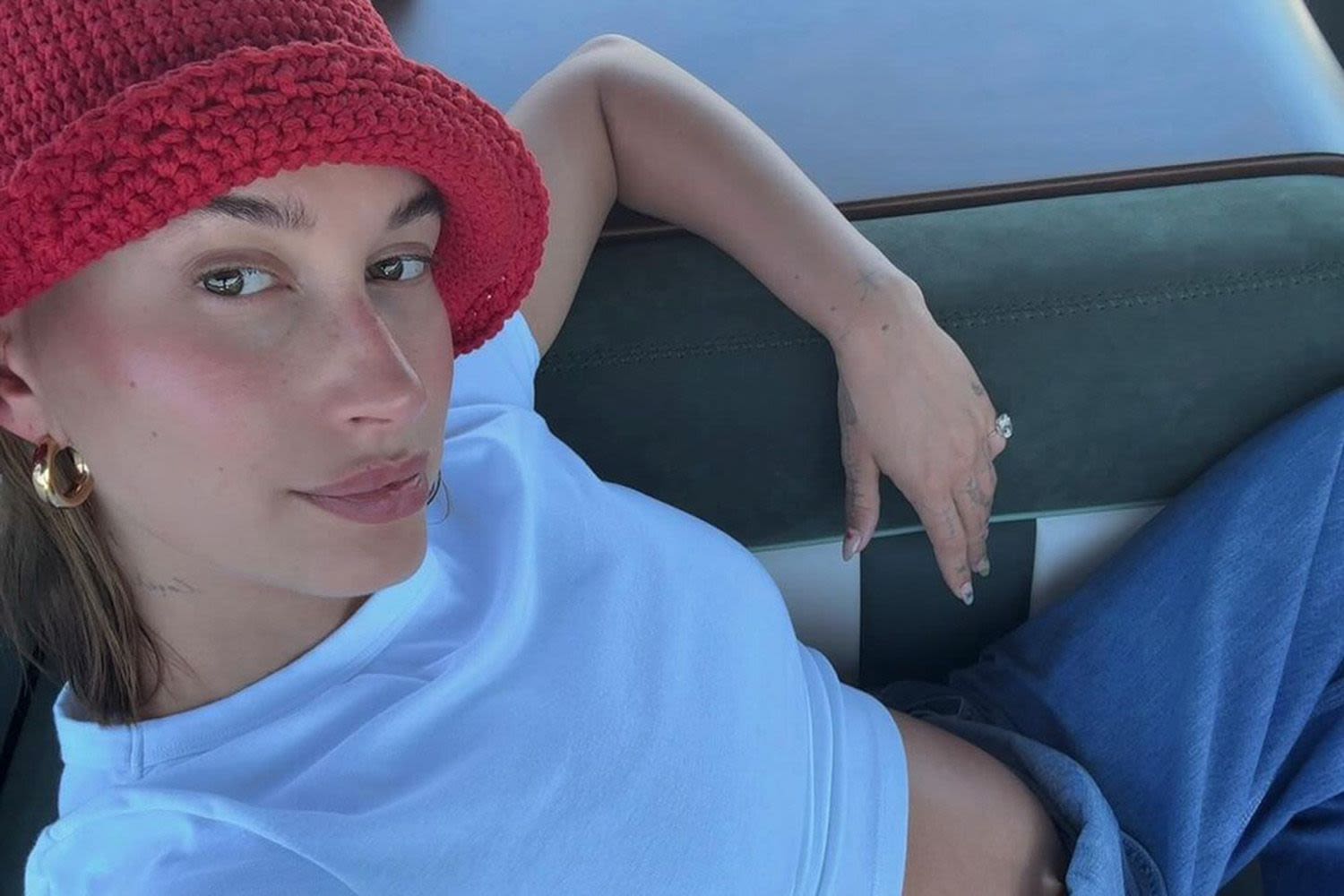 Pregnant Hailey Bieber Shares Peek at Her Bare Bump in Denim Overalls: 'Summer So Far'