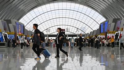 China's railway network witnesses travel peak on 1st day of May Day holiday