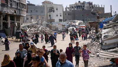 Dozens killed and thousands flee as Israel shrinks ‘humanitarian zone’ in Gaza