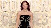 Dua Lipa struggling to sit in her Golden Globes gown shows just how impractical red-carpet fashion can be