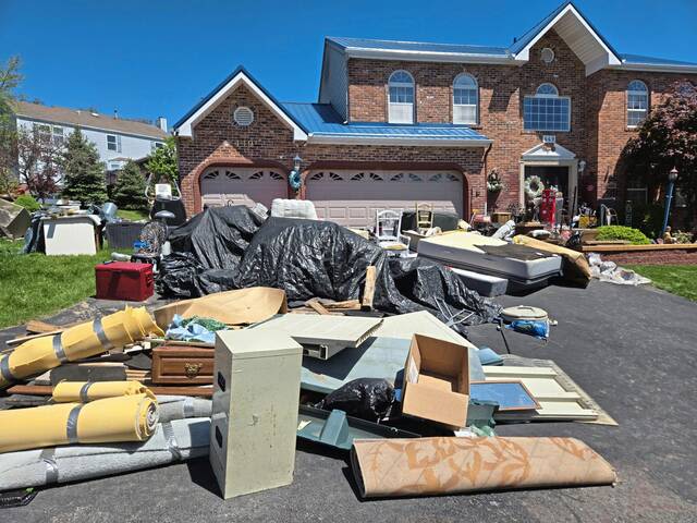 Residents of Plum neighborhood hopeful outside cleanup is start of help for hoarder