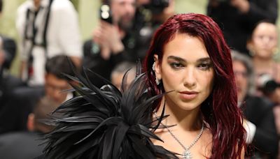 Dua Lipa Wears an All-Black Feathered Look to the 2024 Met Gala