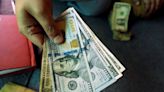 Dollar loses some ground ahead of key global inflation readings