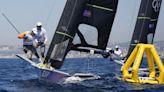 Olympic sailing ready to start with fast windsurfing, bird-like skiffs under light winds, hot sun