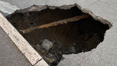 Huge 10ft wide sinkhole in middle of town ignites safety fears