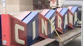 Iconic Cinerama sign comes down as theater takes first step toward reopening with new name